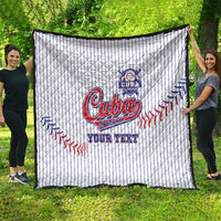 White Cuba baseball quilt spread outdoors, pinstripes with “Cuba” logo, “YOUR TEXT”.