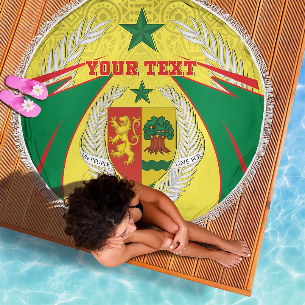 Round beach blanket with white fringe, green and yellow coat of arms crest, “Your Text”
