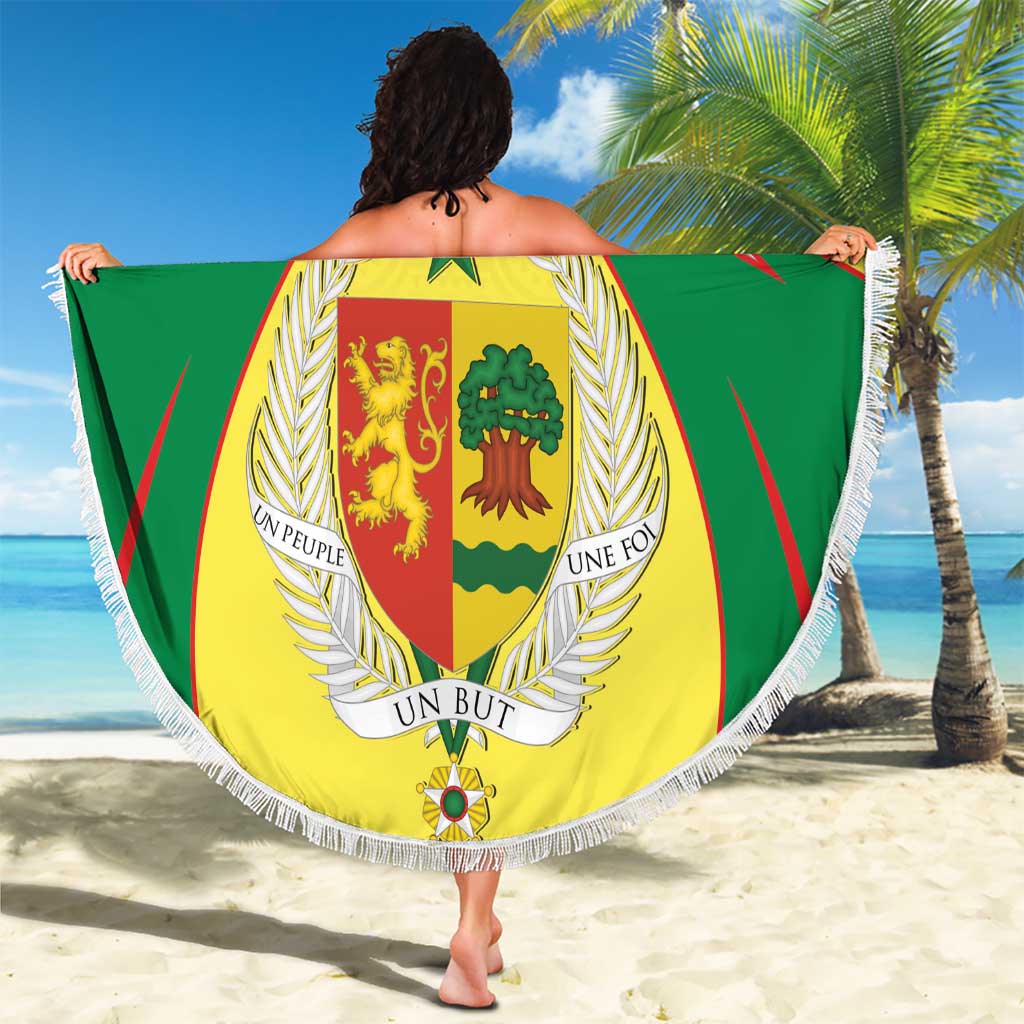 Round beach blanket with white fringe, green and yellow coat of arms crest, large center shield