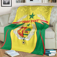 Personalised Senegal blanket coat of arms throw on couch, green backing and yellow crest