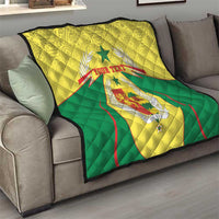 Senegal quilt blanket on gray sofa, yellow/green with coat of arms and custom text