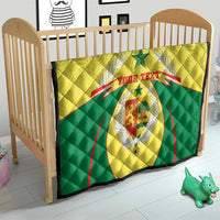 Senegal quilt blanket on toddler bed, yellow/green with coat of arms and custom text