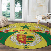 Round green and yellow crest rug on wood floor with laurel and custom text