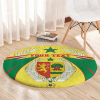 Round yellow-green rug with central coat-of-arms, laurel wreath, and text banner