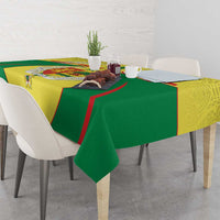 Green, yellow, and red Senegal coat of arms tablecloth draped over dining table
