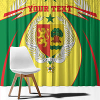 Close-up yellow and green coat-of-arms window curtain with central shield and star