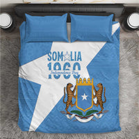 Blue and white bedding set with Somalia crest and lions graphic on duvet