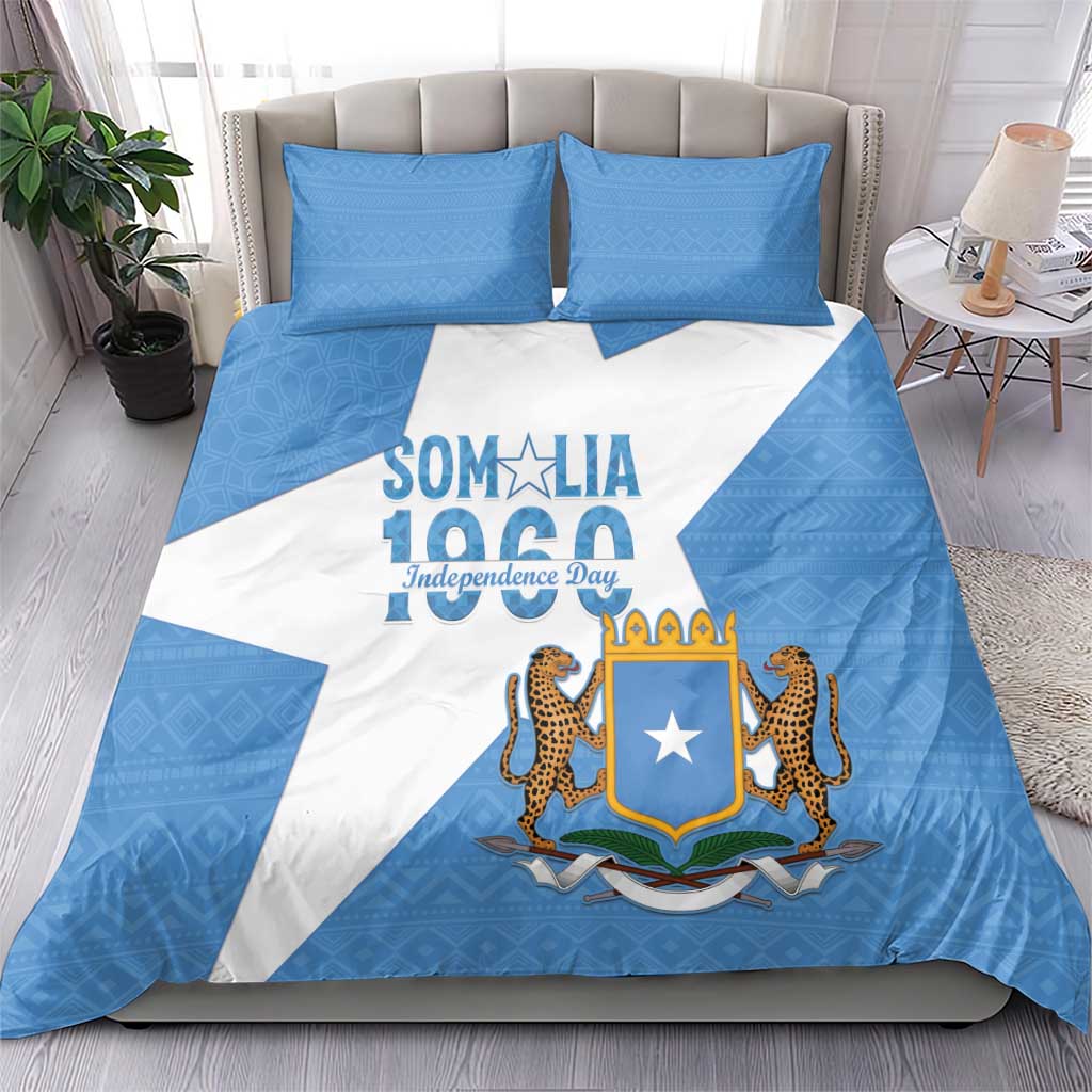 Blue and white bedding set with Somalia crest and lions, shown with matching pillows
