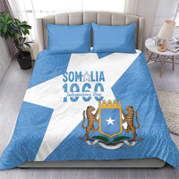 Blue and white bedding set with Somalia crest and lions, shown with matching pillows