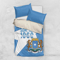 Folded blue and white duvet cover set with Somalia crest and lions