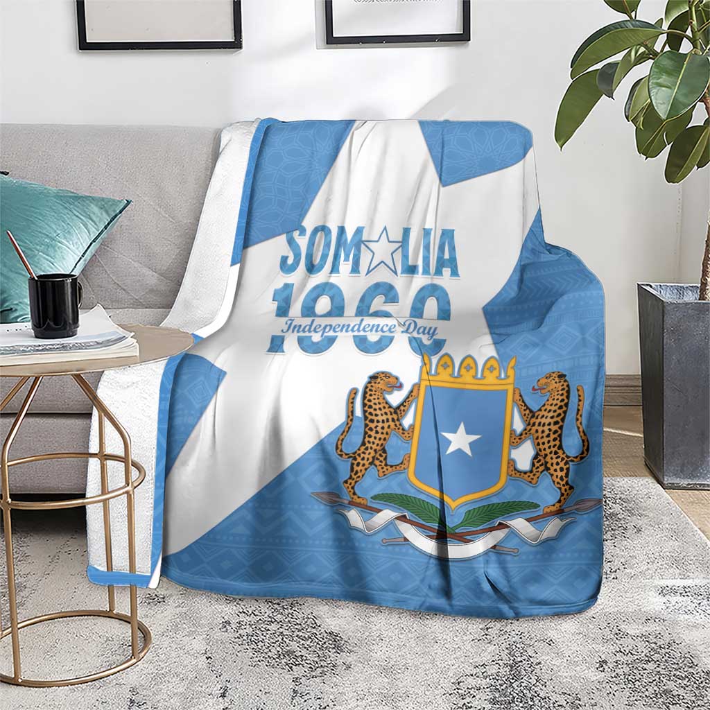 Somalia Independence Day blanket coat on rug, blue-and-white diagonal stripes and emblem
