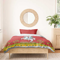 Christmas bedding set on single bed: red duvet with knight-on-horse coat-of-arms design