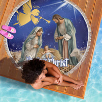 Round blue Christmas nativity beach blanket, white fringe border and illustrated scene