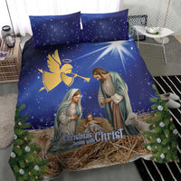 Blue Christmas bedding set featuring angel, Mary and baby nativity with straw manger design