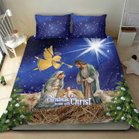 Blue Christmas bedding set with angel and nativity figures, straw manger graphic on duvet