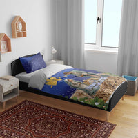Blue Christmas bedding set with angel and nativity print on duvet and matching pillowcases