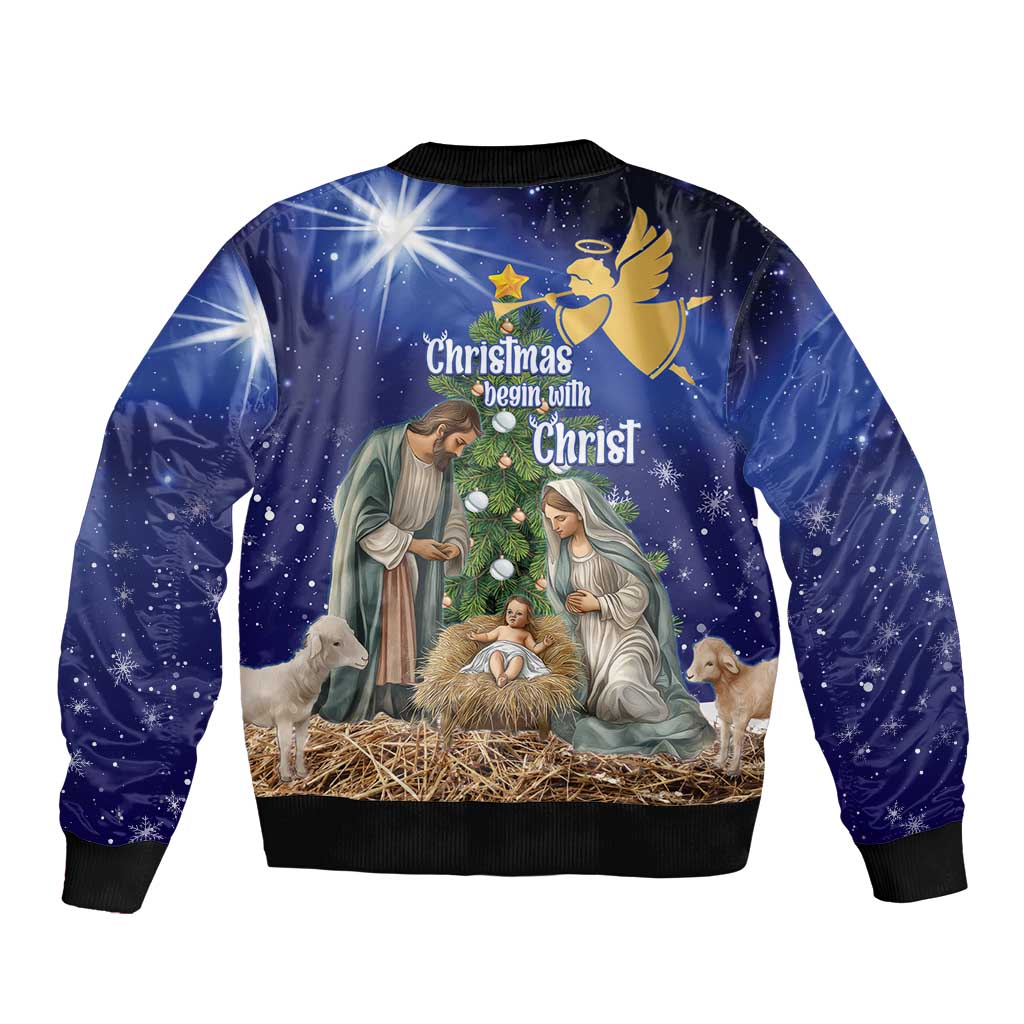 Unisex blue Christmas bomber jacket with back text “Christmas begin with Christ” artwork