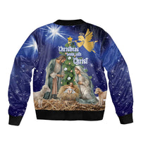 Unisex blue Christmas bomber jacket with back text “Christmas begin with Christ” artwork