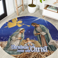 Blue round Christmas nativity rug with Mary, Joseph, baby and “Christmas begin with Christ”