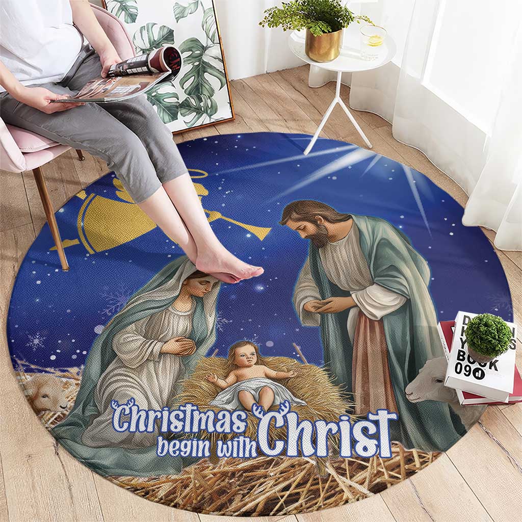 Blue round Christmas nativity rug showing Mary, Joseph, baby, “Christmas begin with Christ”