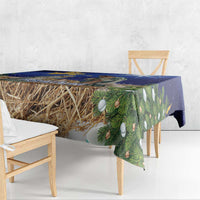 Blue Christmas tablecloth with hay bundle and green fir branch design, corner drape