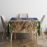 Blue Christmas tablecloth for dining table with straw hay center and evergreen accents