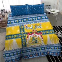 Blue-and-yellow Scandinavian Christmas bedding with two pillows and central crest, God Jul