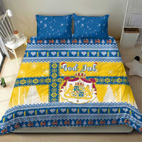 Scandinavian Christmas bedding set with two blue pillows and yellow-and-blue duvet, God Jul