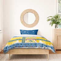 Single blue pillow and yellow-blue Scandinavian Christmas duvet with God Jul text and crest