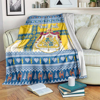 Scandinavian Christmas blanket with blue, yellow, and white pattern and “God Jul” text
