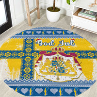 Round Christmas rug with blue and yellow Scandinavian pattern and coat of arms, text God Jul