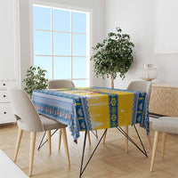 Blue and yellow Scandinavian Christmas tablecloth with border pattern on dining table