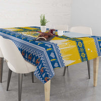 Blue and yellow Scandinavian Christmas tablecloth with geometric trim and festive figures