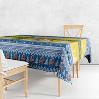 Blue and yellow Scandinavian Christmas tablecloth with repeating figure border