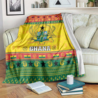 Yellow Ghana Christmas blanket with coat of arms, stars, and striped decorative border