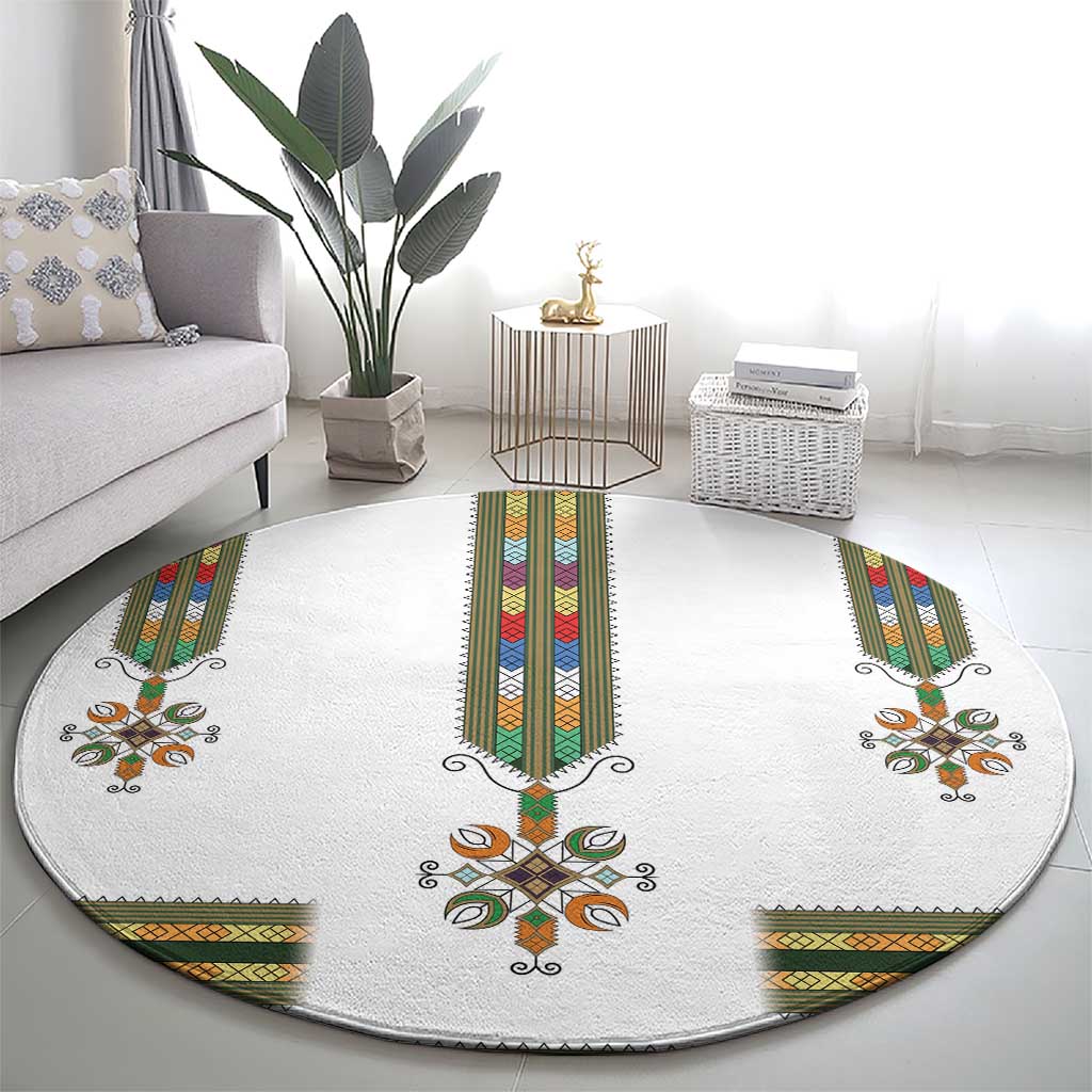 Round white carpet with central cross runner and multicolor geometric ends