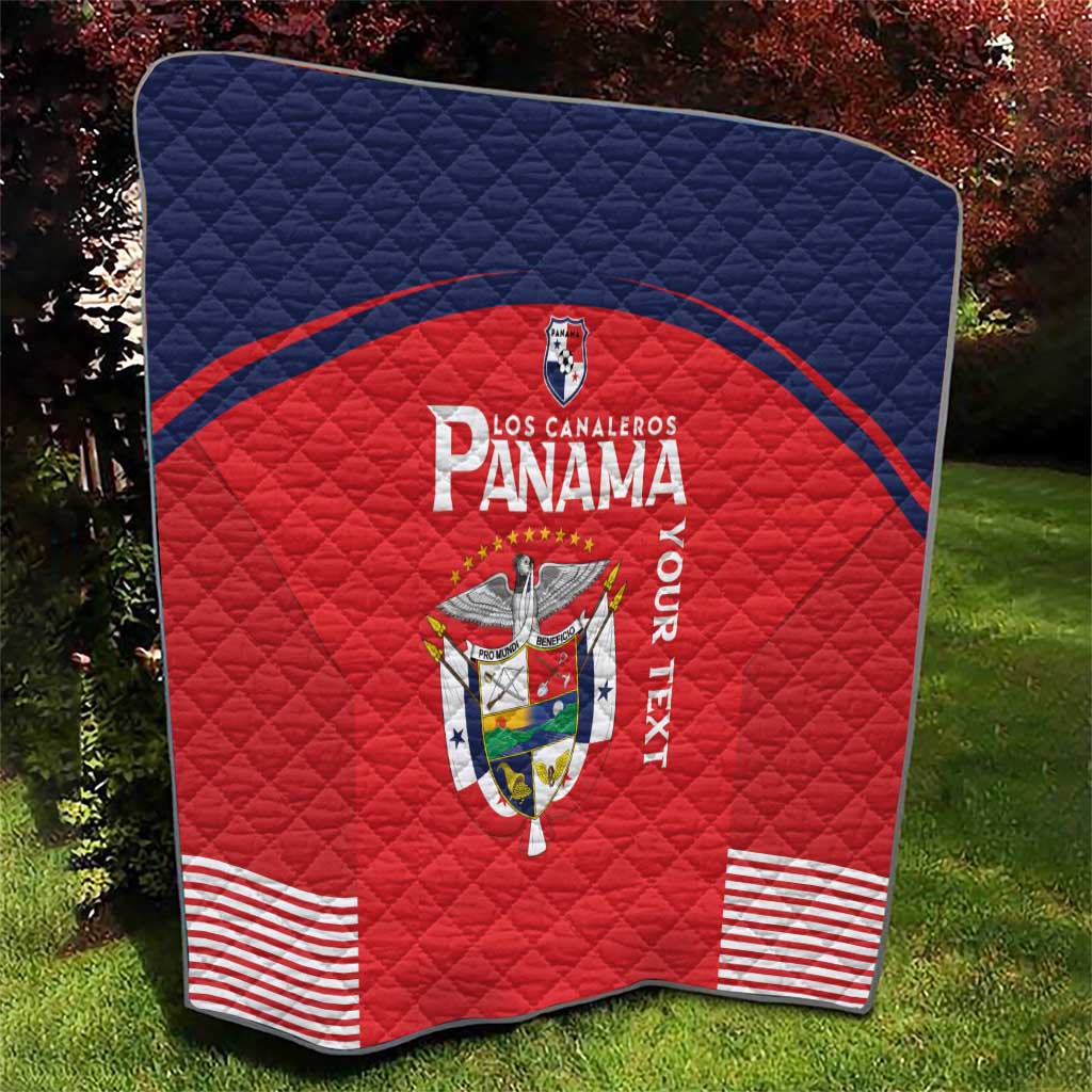 Red and navy Panama quilt blanket with crest logo, “Panama” lettering, and striped corners.