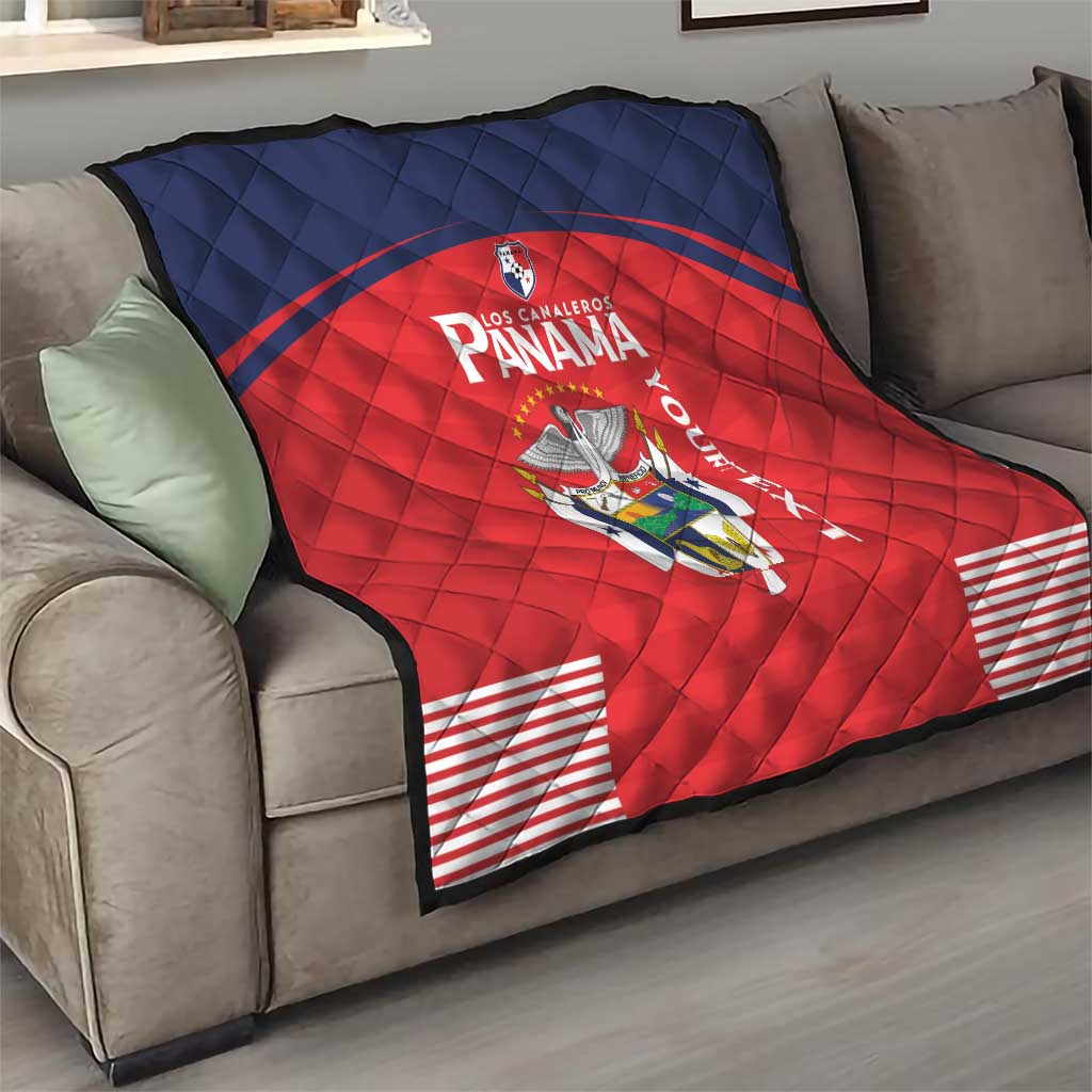 Red and navy Panama quilt blanket draped on sofa with crest logo and “Panama” lettering.