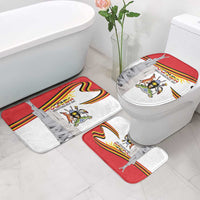 Bathroom set with toilet seat cover and matching floor mats in red, white, and gray