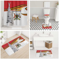 Bathroom set featuring Uganda Independence Day shower curtain, toilet mat, and bath mats