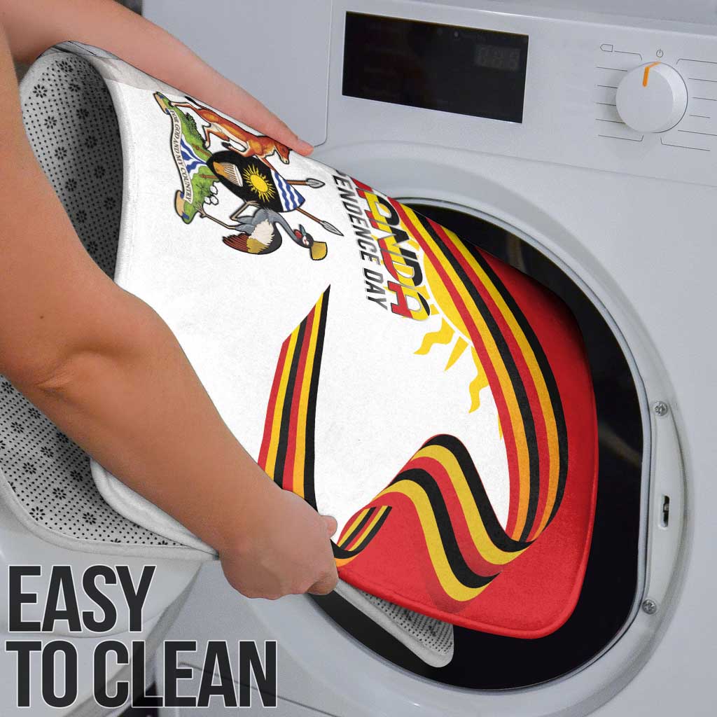 Easy-to-clean Uganda Independence Day shower mat shown on a washing machine
