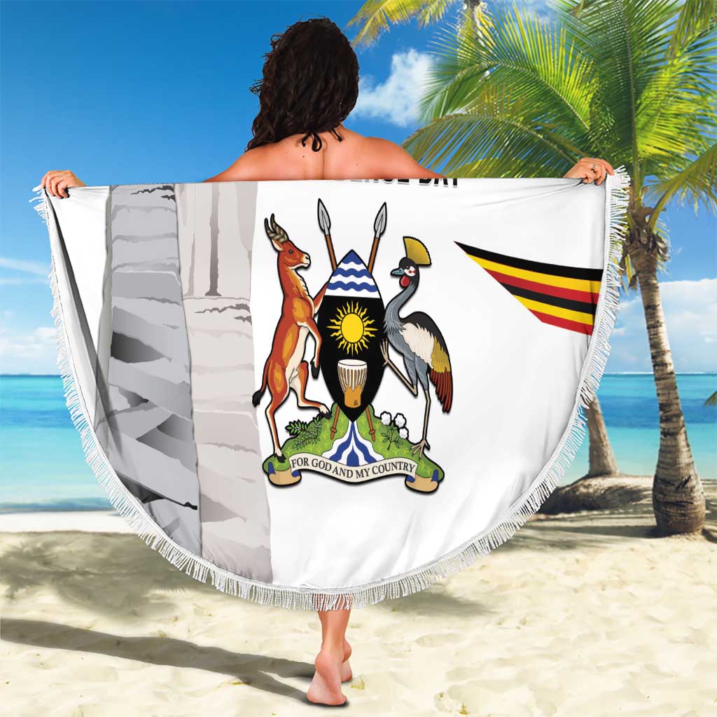 Round beach blanket with Uganda Independence Day graphic and tassel fringe border, held up