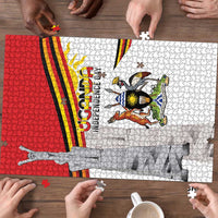 Uganda coat of arms jigsaw puzzle section with flag stripes and pieces being assembled