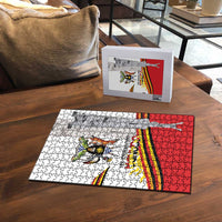 Uganda Independence Day jigsaw puzzle with flag and coat of arms, partially assembled on table
