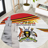 Round Uganda independence rug with coat of arms, monument graphic, red and yellow stripes