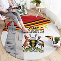 Round rug featuring Uganda independence day crest, monument silhouette, and red yellow stripe design