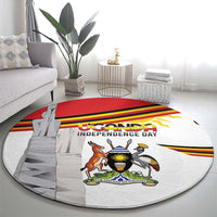 Round Uganda independence day rug with coat of arms, monument graphic, and bold red stripe