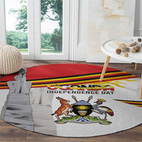 Round rug with Uganda independence day coat of arms, red banner stripes, and monument silhouette