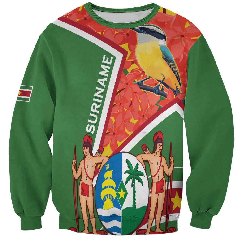 Green unisex sweatshirt with Suriname coat of arms and kiskadee bird graphic