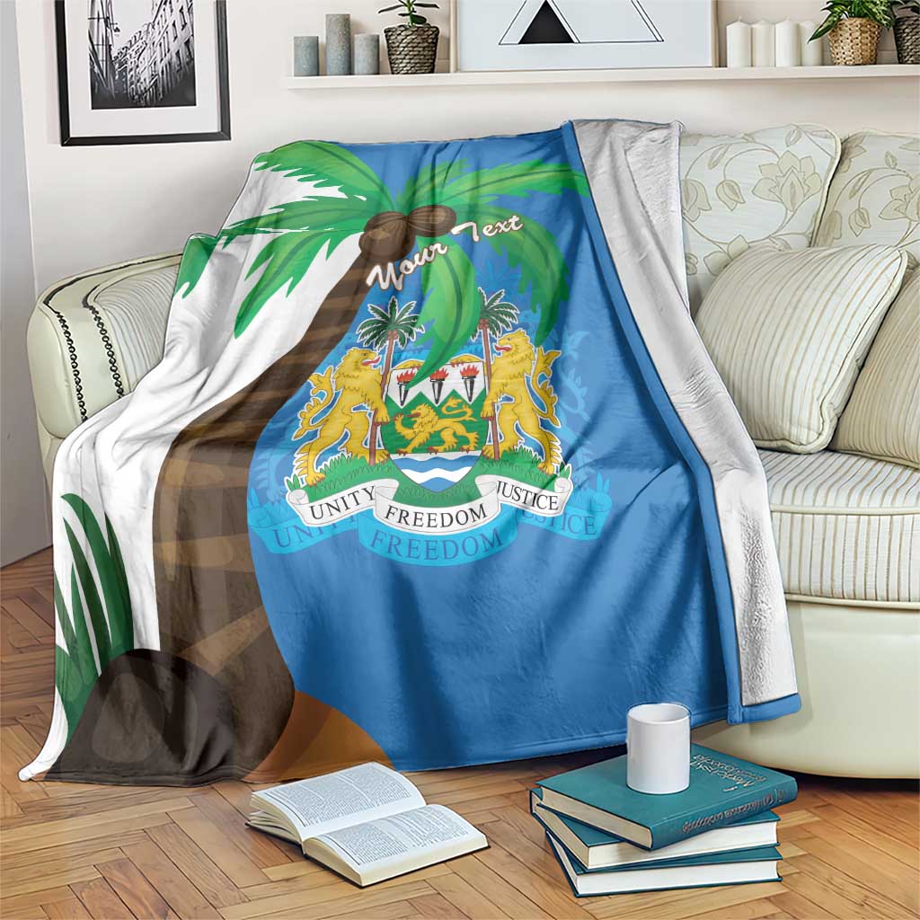 Sierra Leone flag blanket coat in blue with palm trees and crest shield graphic, draped